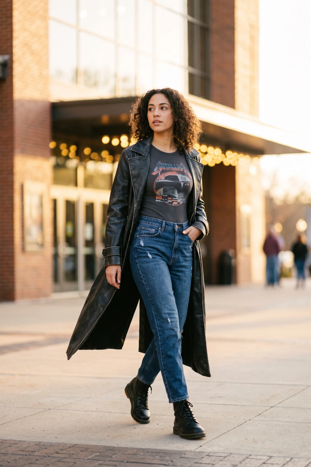 Leather trench coat over a graphic bodysuit, a transitional concert outfit